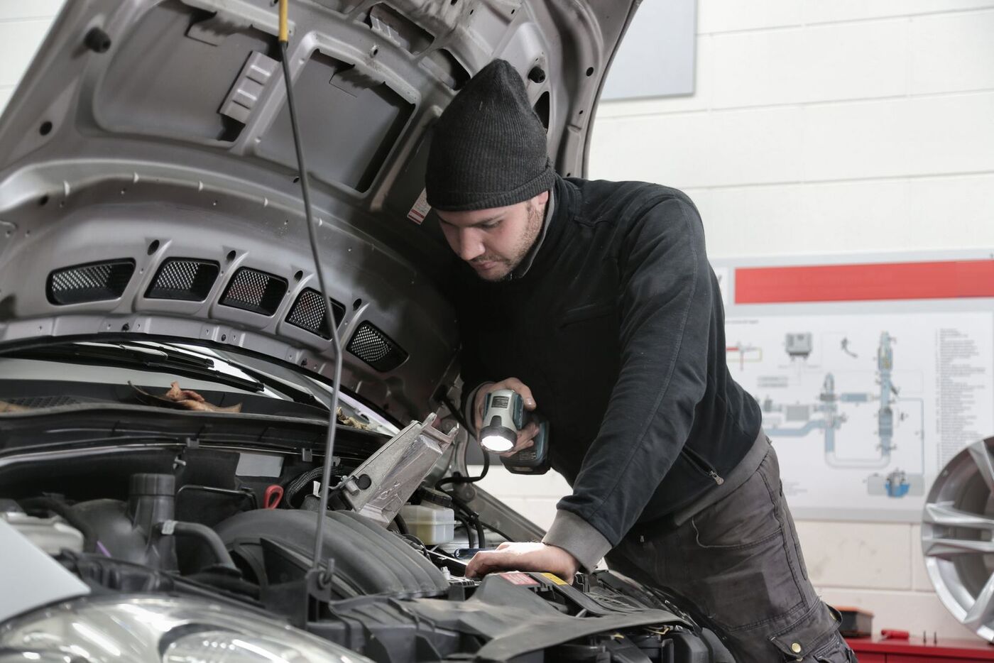 Technician working in an engine bay