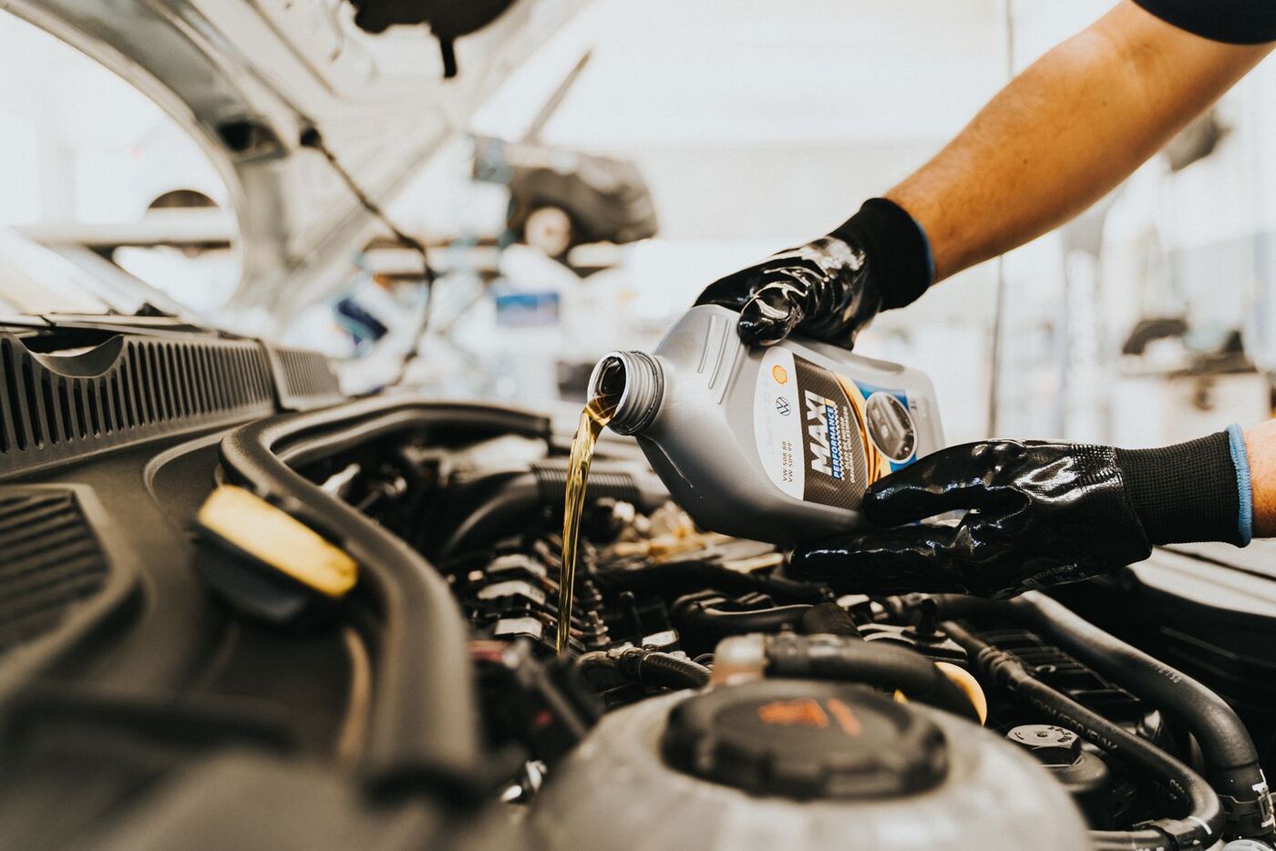 Fresh oil being poured into an engine
